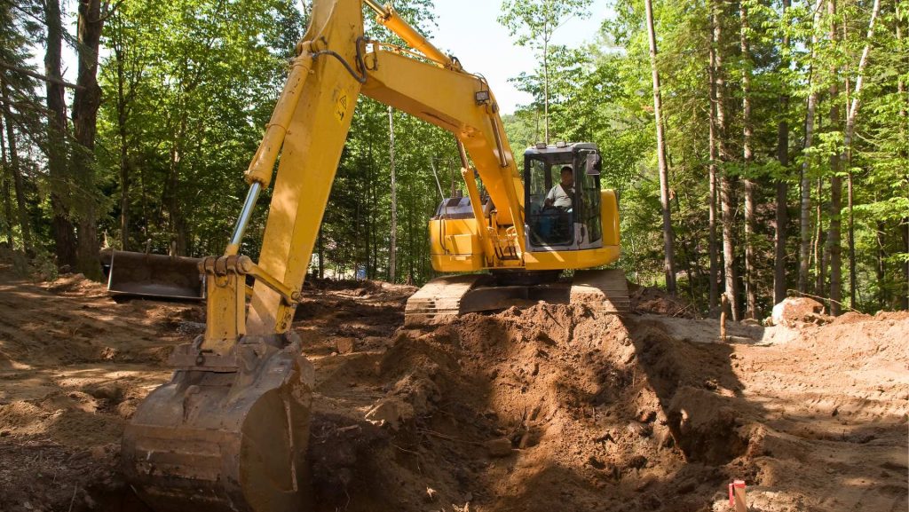 Excavator digging foundation in Huntsville, AL